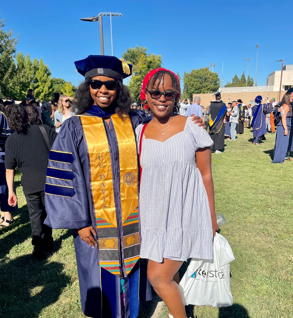 Cynthia with a friend at her doctoral hooding ceremony at UC Davis